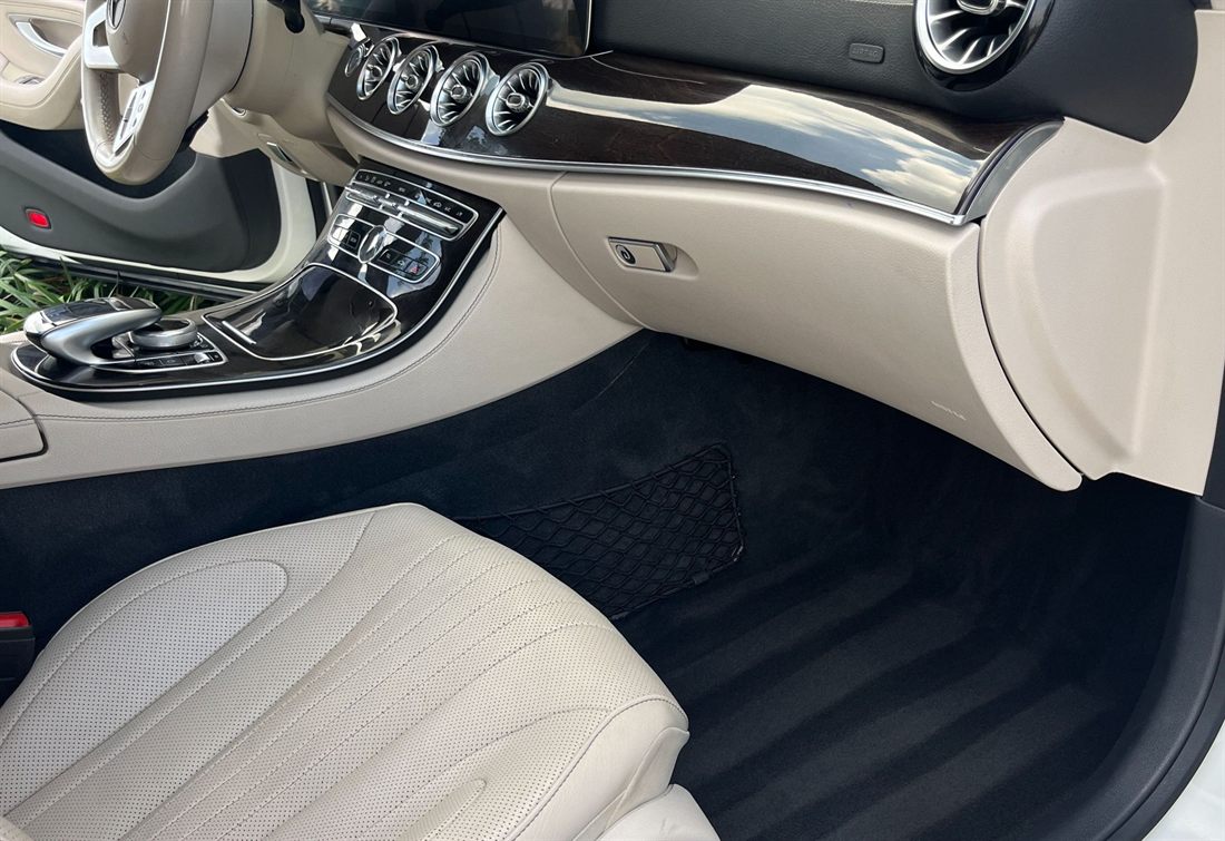 Mercedes-Benz interior with cream leather and freshly shampooed carpet